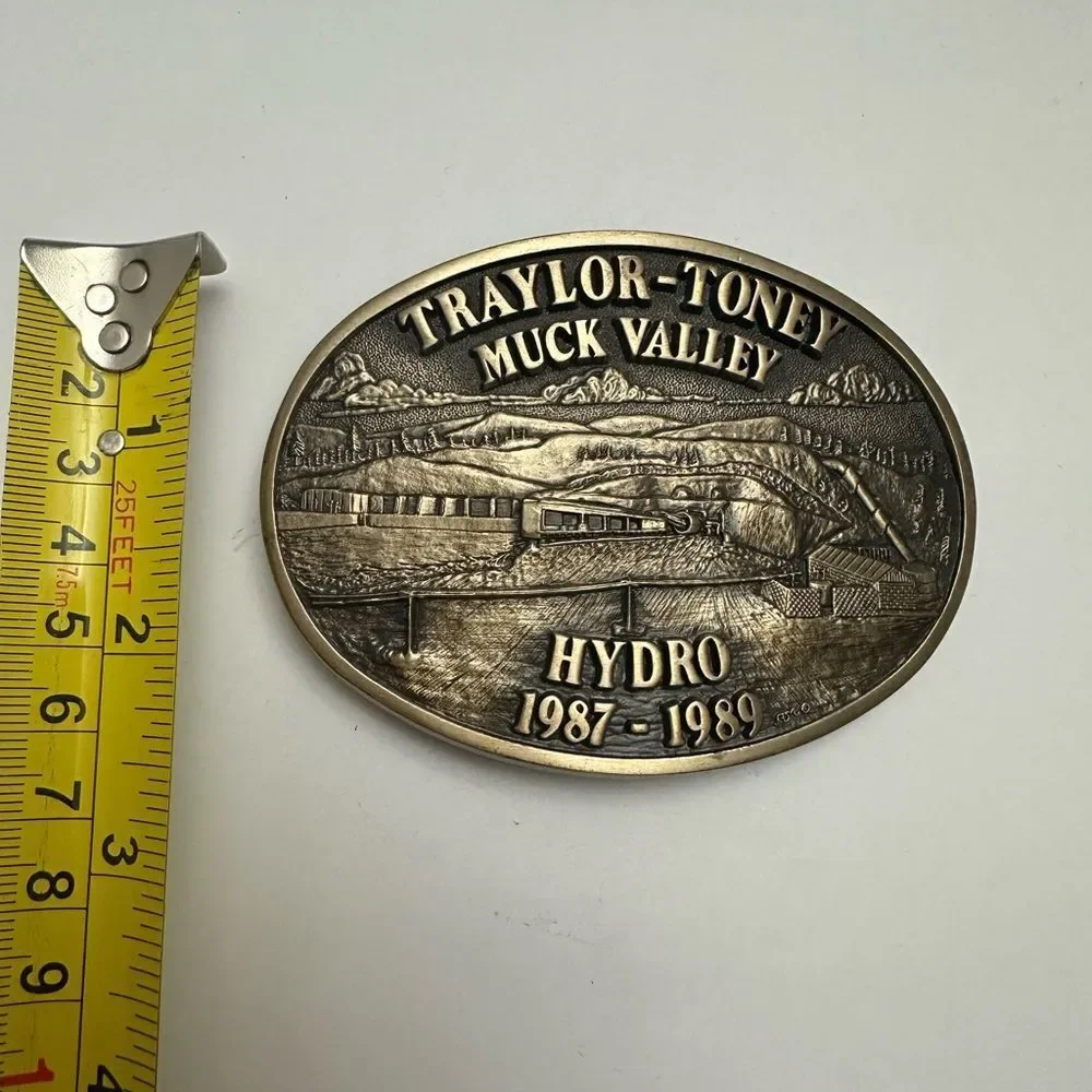 Vintage Solid Brass Traylor-Toney Muck Valley Hydro Belt Buckle 1987-1989 ADM